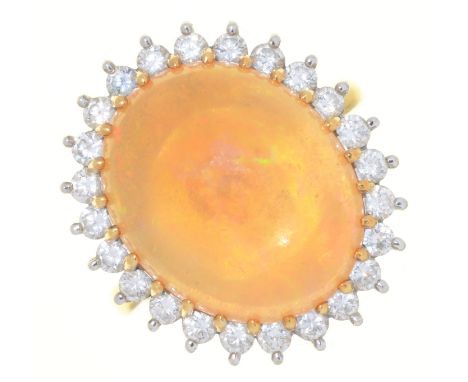 A FIRE OPAL AND DIAMOND RING, THE FIRE OPAL EXHIBITING GOOD PLAY OF COLOUR, IN GOLD MARKED 18CT, 7.5G, SIZE M 