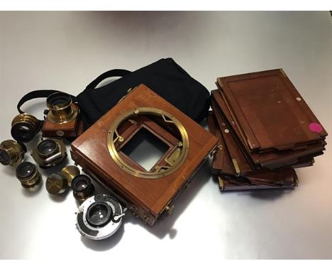 An Appleton half-plate field camera with a Thornton Pickard shutter; together with an F18 brass lens; two Beck symmetrical le