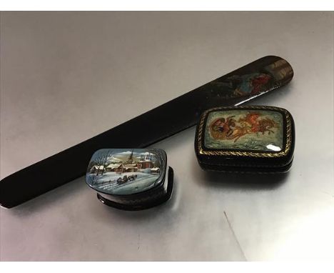 A group of Russian lacquer comprising: a snuff box decorated with a troika drawn by three horses, gilt Mctepa signature; a sn