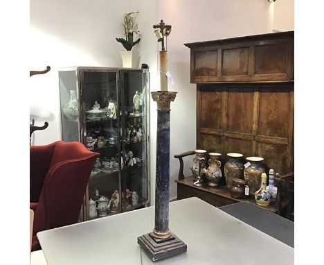 An 18th/19th century carved and painted wooden Corinthian column, converted to a table lamp, with gilt capital over a painted