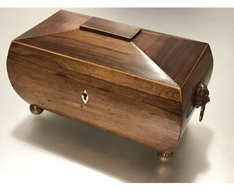 A handsome boxwood-lined rosewood tea caddy, second quarter, 19th century, of bombe sarcophagus form, the interior with a pai