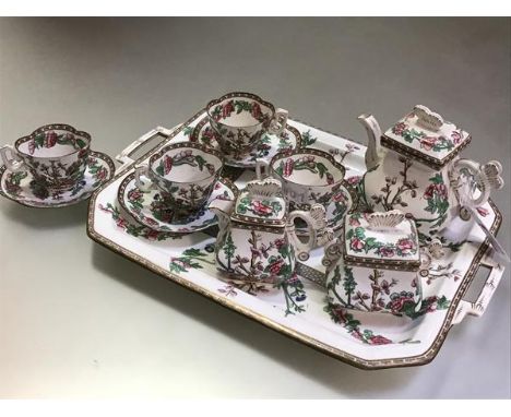 A Coalport Indian Tree pattern cabaret service for our, c. 1880, the teapot, covered cream and sucrier in Oriental style, wit