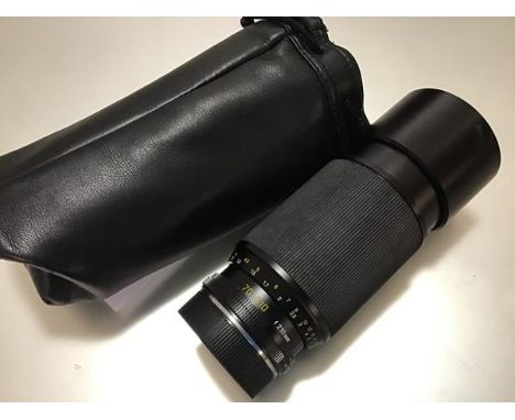 A Leica 70-210mm F4 Vario-Elmar-R lens (lens hood dented) in a soft carry case