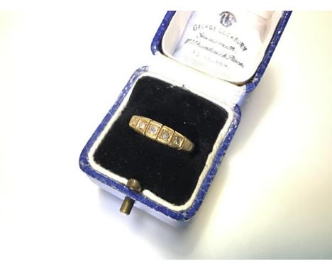 A late Victorian five-stone diamond ring, the graduated round brilliants each in a box setting on a tapering 18ct yellow gold