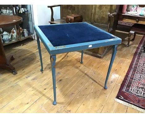 A blue-painted folding card table, c. 1920-30, the square velvet-inset top within a frame painted and gilt-highlighted with p