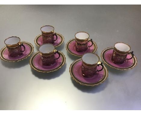 An Aynsley silver-mounted coffee service, James Dixon &amp; Son, Sheffield 1919, the six cans and saucers in pin with a gilt 