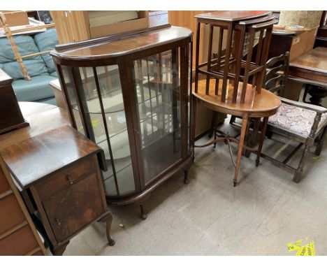 A 20th century mahogany display cabinet together with a bedside cabinet, nest of three tables, an oval occasional table, tabl