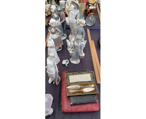 A collection of Lladro figures, together with a Capo di monte figure, Poole pottery jug and flo blue etc