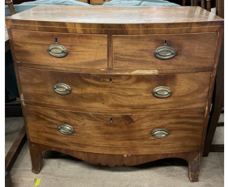 A 19th century mahogany chest, the D shaped crossbanded top above two short and two long drawers and splayed bracket feet
