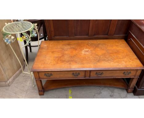 A 20th century walnut coffee table of rectangular form with two drawers and a shelf together with  wirework floral decorated 