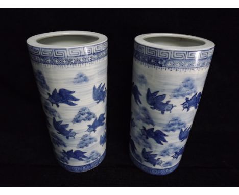 A Large pair of Chinese Blue and White Goldfish Brushpots. The Carp are painted in a pond scene. Greek Key and Scroll Borders