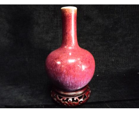 Small Chinese Flambe-Glazed Bottle Vase on later Rosewood stand. Of pear-shaped bottle form, with globular body surmounted wi