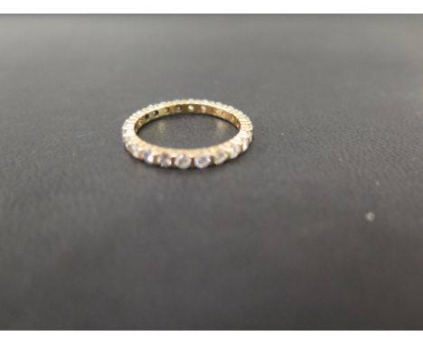 A brilliant-cut diamond full-circle eternity ring - Estimated total diamond weight 0.75ct - Tests as gold - Ring size N 1/2 -