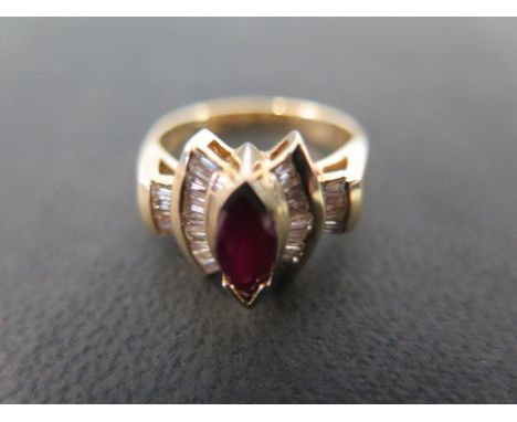 A ruby and diamond deco style dress ring - Stamped 14K - Ring size M - Weight approx 5.2gms.
Condition Report: Good - With li