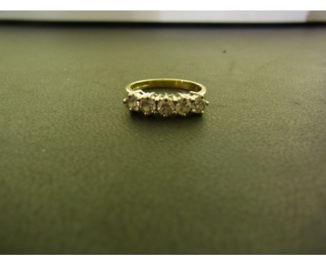 An 18ct gold diamond five-stone ring - The brilliant-cut diamonds to the plain band - Hallmarked Birmingham - Ring size K 1/2