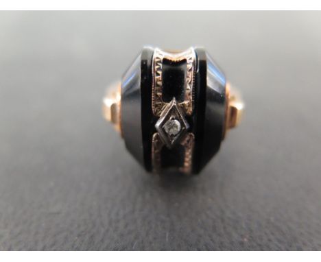 An onyx and diamond deco style rings - Stamped 10K - Ring size M - Weight approx 4.8gms
Condition Report:Good to fair - With 