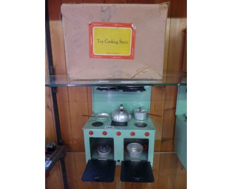 A Chad Valley tinplate cooker with kettle, pans, saucepans, plates with original box
Condition report: Very good condition 