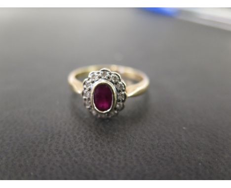 A 9ct gold ruby and diamond cluster ring - Hallmarked Birmingham - Ring size P - Weight approx 2.9gms
Condition Report: Good 
