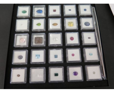 A collection of twenty-five gemstones - To include emerald, fluorite, garnet, iolite, kyanite, morganite, peridot, quartz, ru