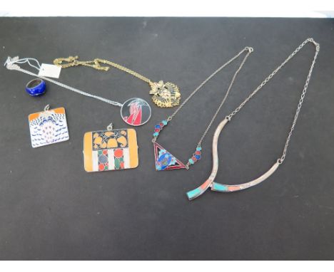 An assortment of enamel jewellery - To include five pendants, a necklace and a ring.
Condition Report: Good to fair - With so