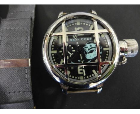 A Russian USSR/CCCP oversized divers watch, steel case with protective grill, black enamel dial with luminous markings enclos