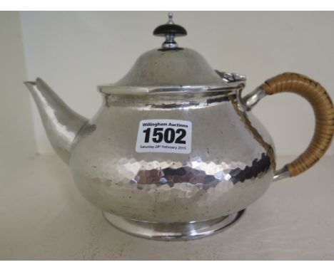 A Liberty Tudric polished, planished teapot no. 01075
