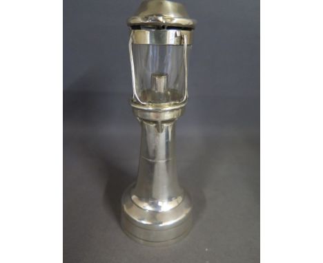 An unusual silver lighthouse table lighter hallmarks for Chester 1910 makers mark Rubbey Grey and Co - 1909 onwards - has som