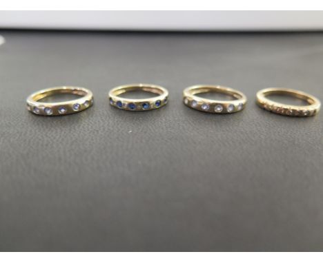 Four 9ct gold gem-set band rings - To include diamond, sapphire and tanzanite - Hallmarked Birmingham - Ring sizes K 1/2, L a