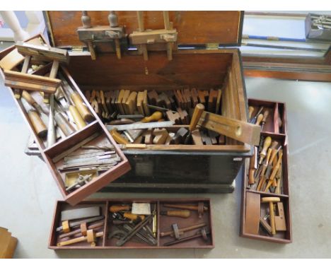 A good Carpenters tool chest with a collection of moulding planes chisel spoke shaves and other tools to S. Martin