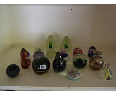 A collection of seventeen paperweights to include Medina, Caithness, Wedgewood and some un-named includes dumps, vases and an