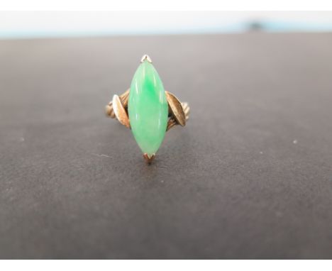 A jade ring - Tests as gold - Ring size K - Weight approx 3.4gms
Condition Report: Good to fair - With surface dent and scrat