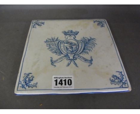 A Galle blue and white armorial teapot stand on ceramic bun feet - the stand measures 17 x 17 cm - Motto Non Invitus Premor
C