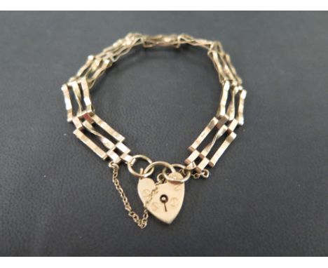 A 9ct gold two-bar gate bracelet - Hallmarked London - Length 17.5cms - Weight approx 8.3gms
Condition Report: Good - With li