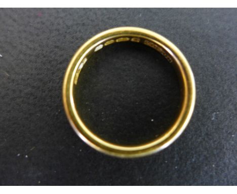 A 22ct gold band ring - Hallmarked London - Ring size K - Weight approx 4.4gms
Condition Report: Good - With light scratches 