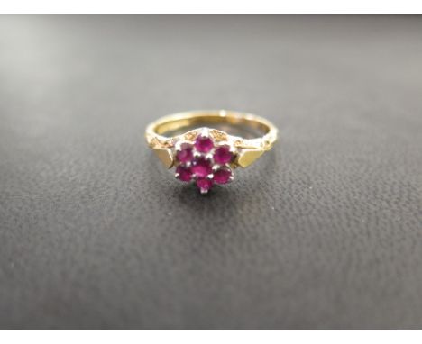 A 1970s 18ct gold ruby cluster ring - Hallmarked Birmingham - Ring size P 1/2 - Weight approx 3.1gms
Condition Report: Good
