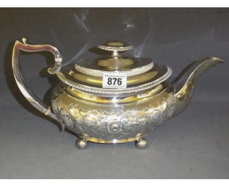 A late George III silver teapot with embossed foliate decoration and gadrooned rims - Hallmarked London 1816 - 17 - makers ma