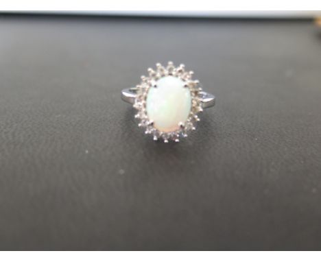 A 9ct gold opal and diamond cluster ring - Hallmarked Birmingham - Ring size O - Weight approx 2.6gms
Condition Report: Good