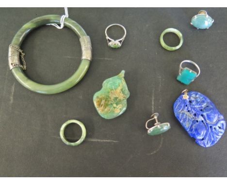 A collection of eight pieces of hardstone jewellery including Jade or Jadeite - some pieces with silver mounts and two pendan