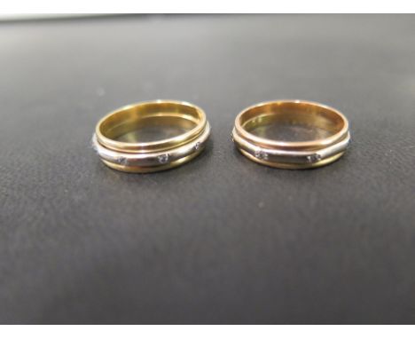 Two bi-colour diamond-set full-circle band rings - Test as 18ct gold - Ring sizes M 1/2 and K 1/2 - Weight approx 6.6gms
Cond