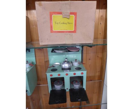 A Chad Valley tinplate cooker with kettle, pans, saucepans, plates with original box
Condition report: Very good condition 