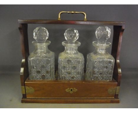 A modern three decanter Tantalus 
Condition report:  All good condition