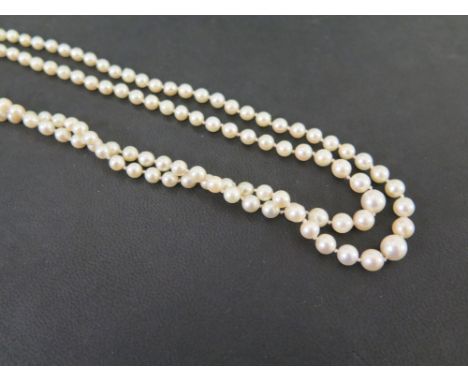 A graduated cultured pearl two-row necklace - Pearls measure approx 4mm - 7mm - To the plain clasp - Length approx 44cms 
Con