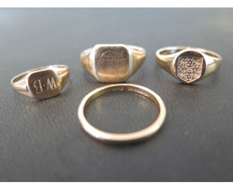 Three signet rings and a band ring - All with marks indicating 9ct gold - Ring sizes L, R and U - Total weight approx 14.1gms