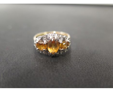 An 18ct gold citrine and diamond cluster dress ring - Hallmarked London - Ring size R - Weight approx 4.5gms
Condition Report