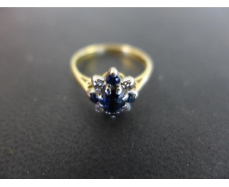 A sapphire and diamond cluster ring - Stamped 18ct - Ring size K - Weight approx 3.1gms
Condition Report: Good to fair - With