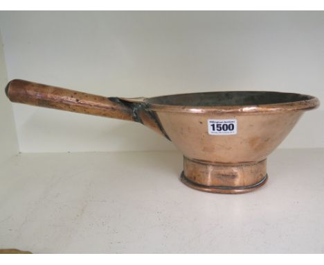 An early 19th century copper ladle