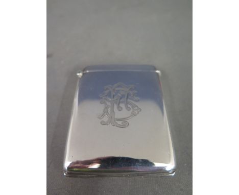 A good silver card case with a fold down front revealing a portrait holder with gilt interior Birmingham 1904-04 maker PP Ld 