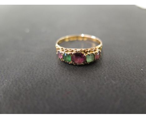 An early 20th century 15ct gold multi gem-set ring - To include garnet and emerald - Hallmarked Birmingham - Ring size P - We