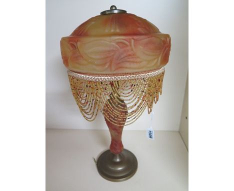 A brass table lamp with a coloured glass centre and shade signed J Maelle - Height 48 cm 
Condition report: Needs wiring 