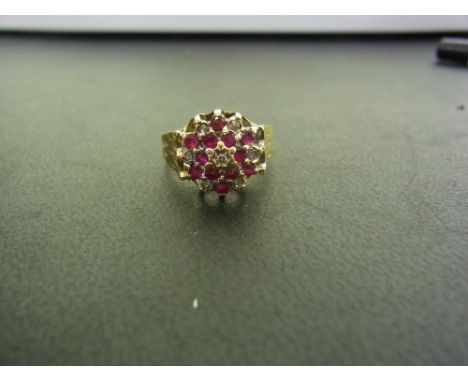 A 9ct gold ruby and diamond cluster ring - Hallmarked Birmingham - Ring size K 1/2 - Weight approx 3.5gms
Condition Report: G